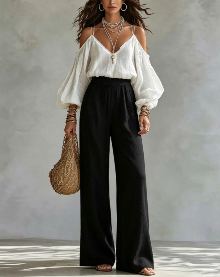 Ensemble deux pièces composé d’un haut à épaules dénudées et manches bouffantes, col en V, et d’un pantalon large taille haute